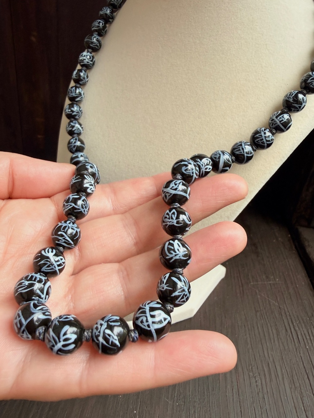 Black hand painted artisan Beaded Necklace  Light Blue Script Accents